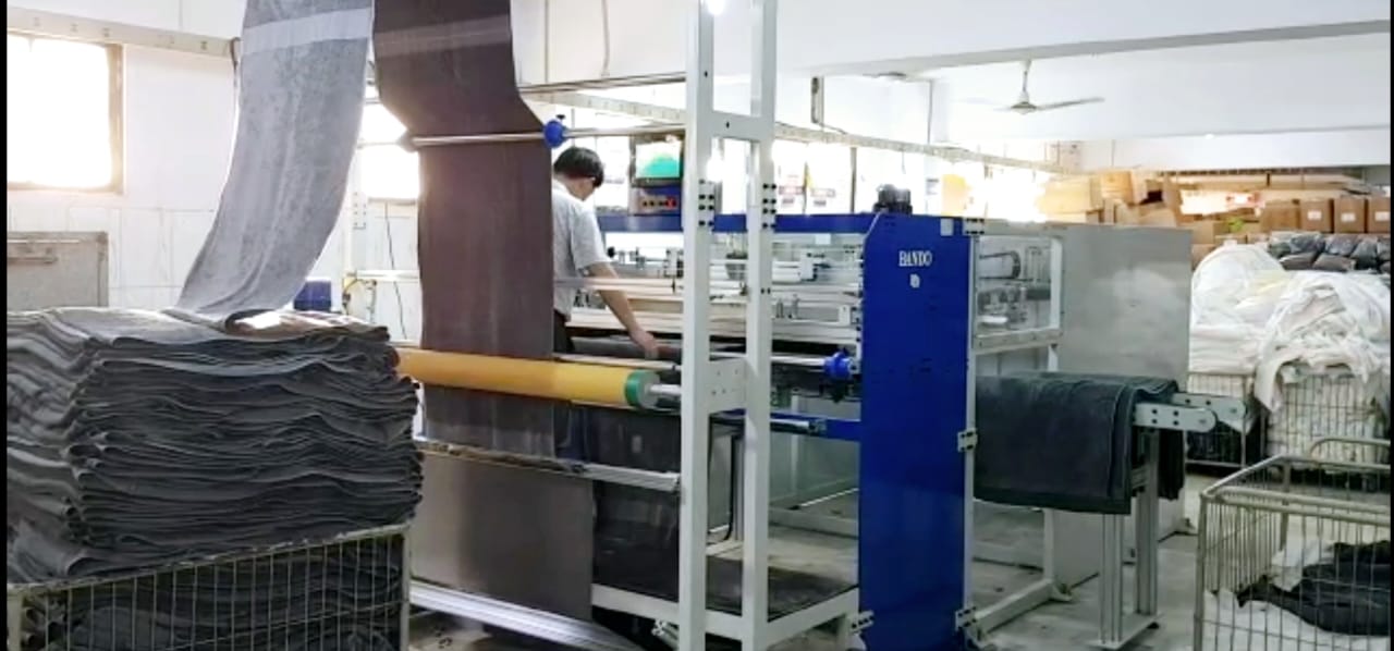 Bando Auto Cross Cutting Machine in high volume towel manufacturing plant