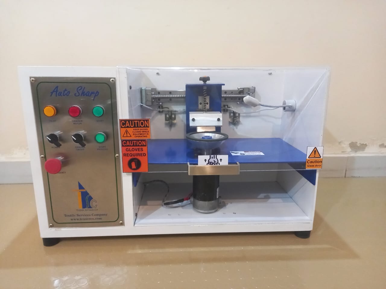 Precision hemming machine knife sharpener for automated sewing line trimmer blades